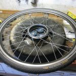Bike wheel supported by car tyre